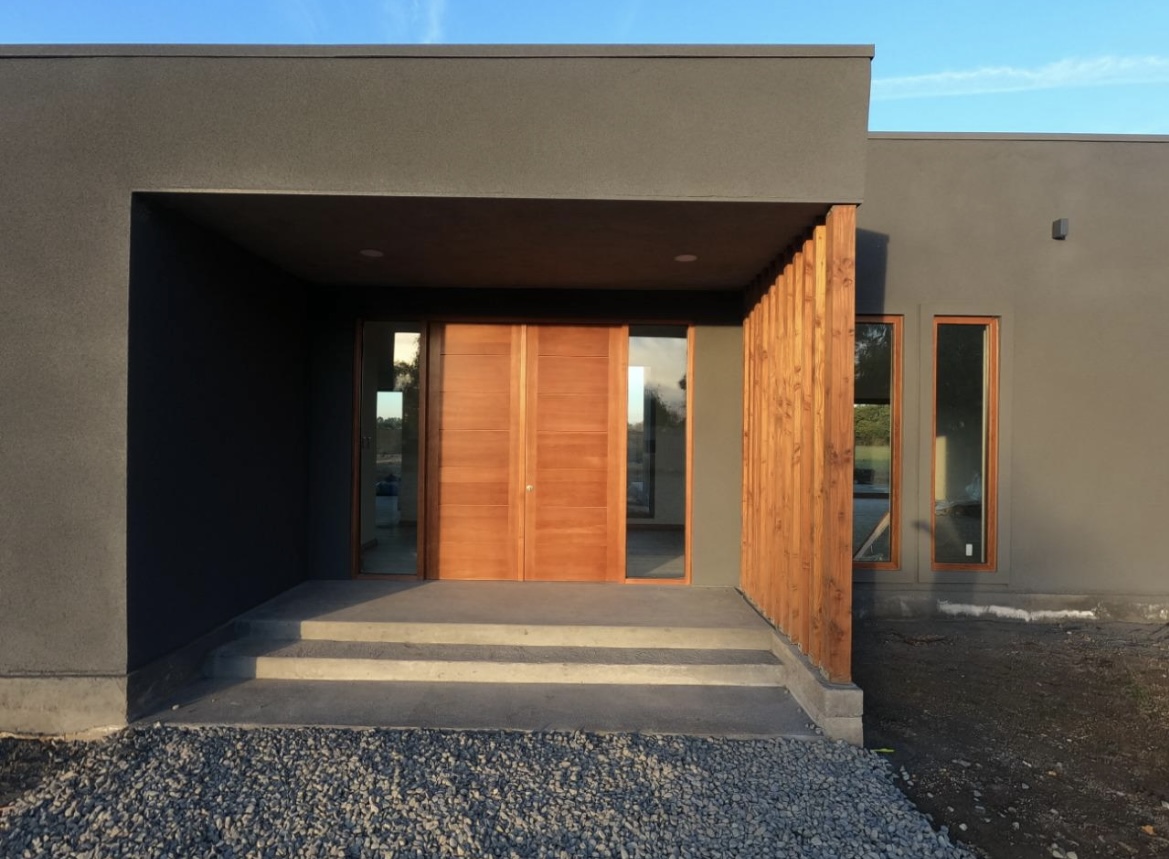 Grey spray cork finish on a modern residential facade